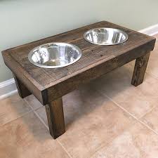 homemade dog bowl and water stand of wood